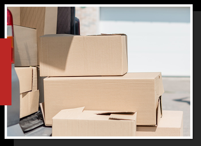 Offsetting the Stress of Moving Images of boxes spilling out of the back of a car