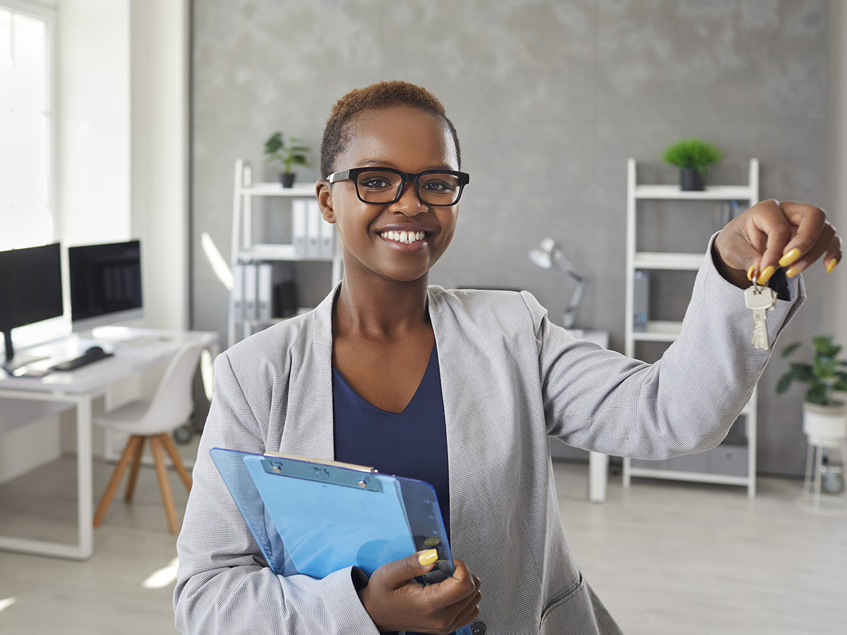 Image of a women in an office with keys